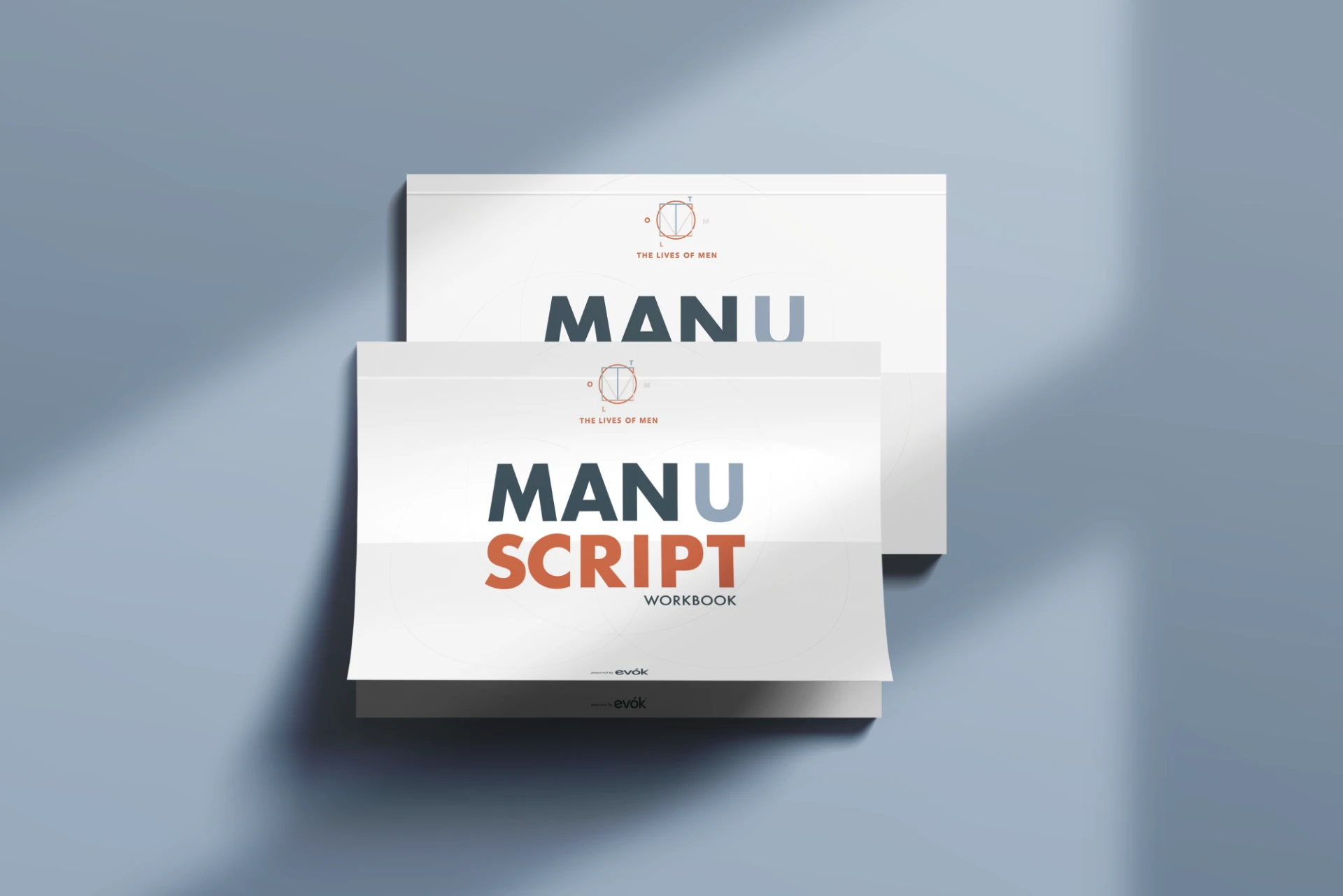 Two ManUScript workbook covers stacked on a blue background