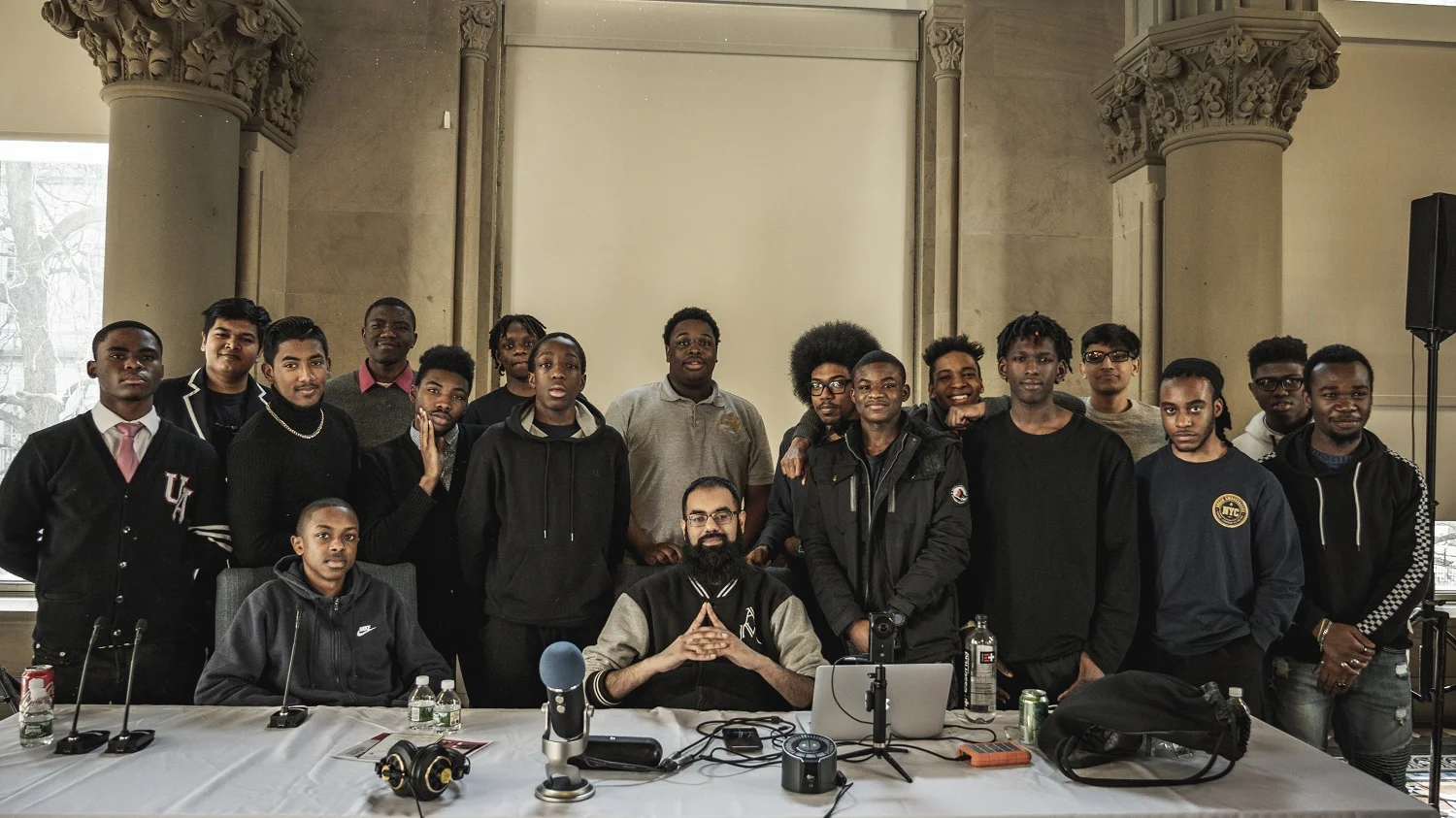 NYC Urban Ambassadors group portrait — young men gathered after a Meet the Masters session