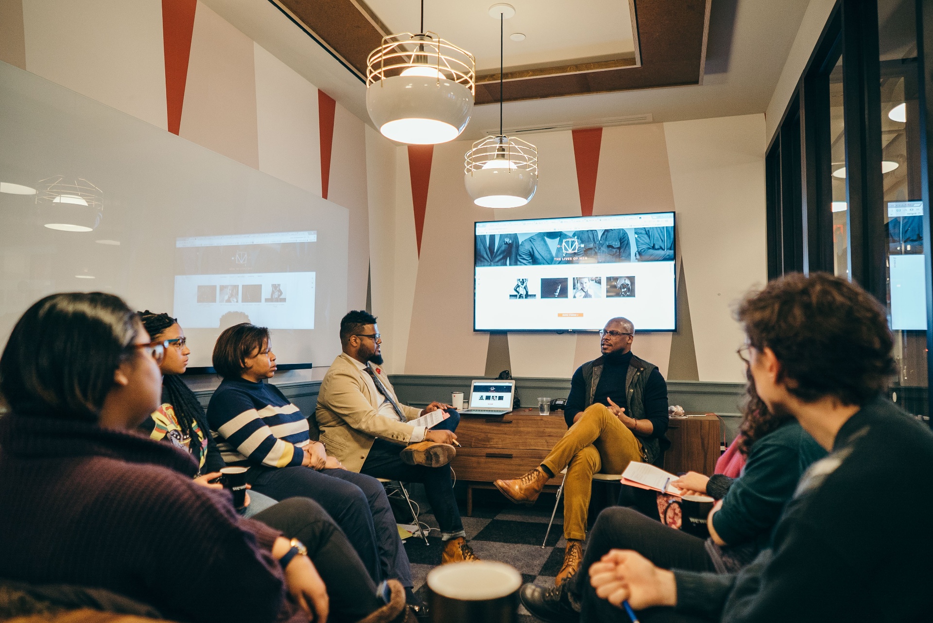 Facilitator in dialogue with a small group